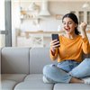 woman_using_smartphone_on_couch